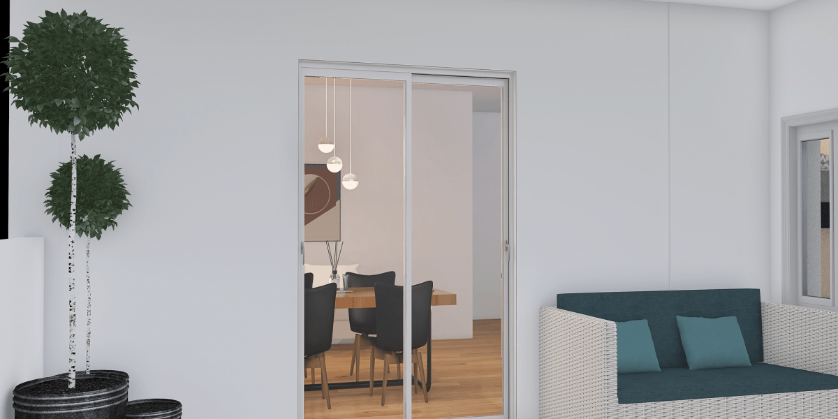Puerta Corredera de aluminio transparente de una vivienda situada en Barcelona